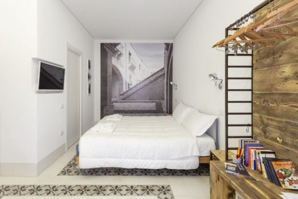 Letto o letti in una camera di Dione Apartments by Dimore in Sicily Ortigia